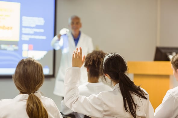 Science professor giving lecture to class at the university